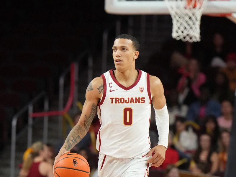 Nov 29, 2023; Los Angeles, California, USA Southern California Trojans guard Kobe Johnson (0) dribbles the ball against Eastern Washington Eagles in the second half at Galen Center. Mandatory Credit: Kirby Lee-USA TODAY Sports