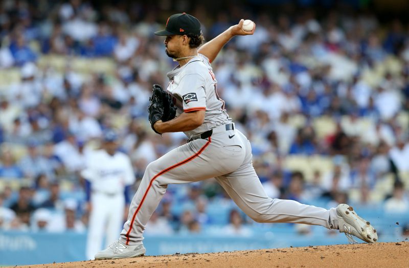 Jul 23, 2024; Los Angeles, California, USA; San Francisco Giants pitcher Jordan Hicks (12) throws during the first inning against the Los Angeles Dodgers at Dodger Stadium. Mandatory Credit: Jason Parkhurst-USA TODAY Sports