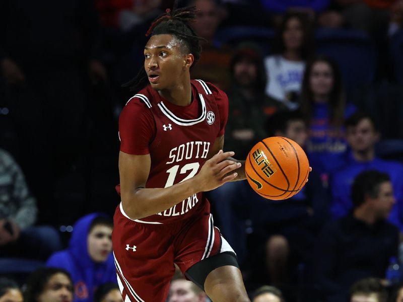 Jan 25, 2023; Gainesville, Florida, USA; South Carolina Gamecocks guard Zachary Davis (12) dribbles against the Florida Gators during the first half at Exactech Arena at the Stephen C. O'Connell Center. Mandatory Credit: Kim Klement-USA TODAY Sports