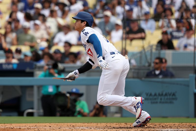 Sep 21, 2025; Los Angeles, California, USA;  Los Angeles Dodgers designated hitter Shohei Ohtani (17) hits a broken bat single during the sixth inning against the San Francisco Giants at Dodger Stadium. Mandatory Credit: Kiyoshi Mio-Imagn Images