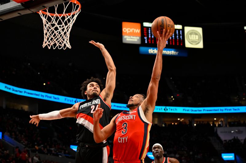 PORTLAND, OREGON - APRIL 09: CJ McCollum #3 of the New Orleans Pelicans shoots against Justin Minaya #24 of the Portland Trail Blazers during the first quarter of the game at the Moda Center on April 09, 2024 in Portland, Oregon. The New Orleans Pelicans won 110-100. NOTE TO USER: User expressly acknowledges and agrees that, by downloading and or using this photograph, User is consenting to the terms and conditions of the Getty Images License Agreement. (Photo by Alika Jenner/Getty Images)