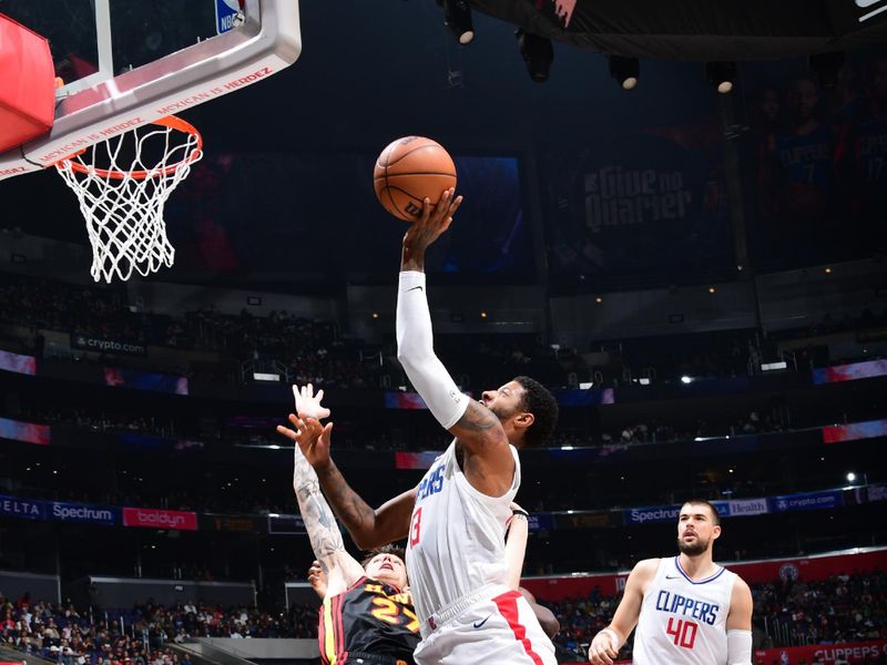 LOS ANGELES, CA - MARCH 17: Paul George #13 of the LA Clippers drives to the basket during the game against the Atlanta Hawks on March 17, 2024 at Crypto.Com Arena in Los Angeles, California. NOTE TO USER: User expressly acknowledges and agrees that, by downloading and/or using this Photograph, user is consenting to the terms and conditions of the Getty Images License Agreement. Mandatory Copyright Notice: Copyright 2024 NBAE (Photo by Adam Pantozzi/NBAE via Getty Images)