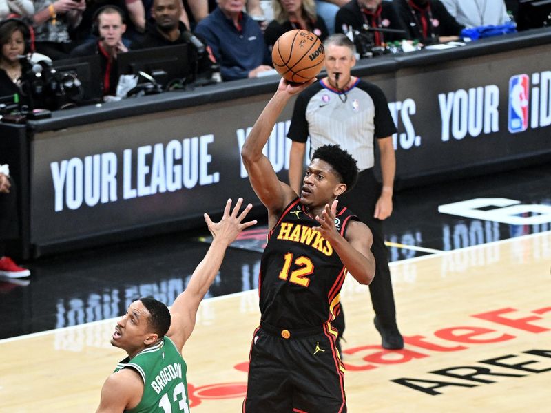 ATLANTA, GA - APRIL 21: De'Andre Hunter #12 of the Atlanta Hawks shoots the ball during the game against the Boston Celtics during round one game three of the 2023 NBA Playoffs on April 21, 2023 at State Farm Arena in Atlanta, Georgia.  NOTE TO USER: User expressly acknowledges and agrees that, by downloading and/or using this Photograph, user is consenting to the terms and conditions of the Getty Images License Agreement. Mandatory Copyright Notice: Copyright 2023 NBAE (Photo by Adam Hagy/NBAE via Getty Images)