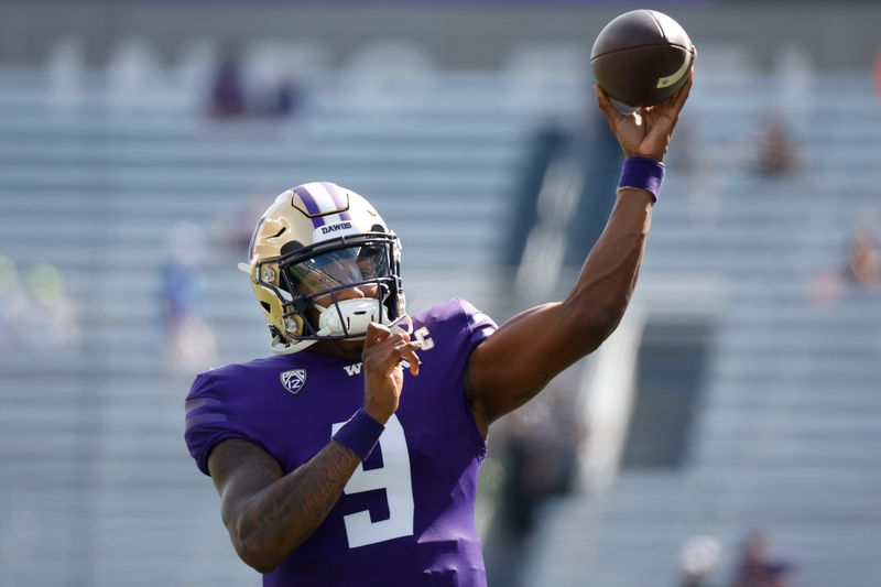 Sep 2, 2023; Seattle, Washington, USA; Washington Huskies quarterback Michael Penix Jr. (9) participates in pregame warmups against the Boise State Broncos at Alaska Airlines Field at Husky Stadium. Mandatory Credit: Joe Nicholson-USA TODAY Sports