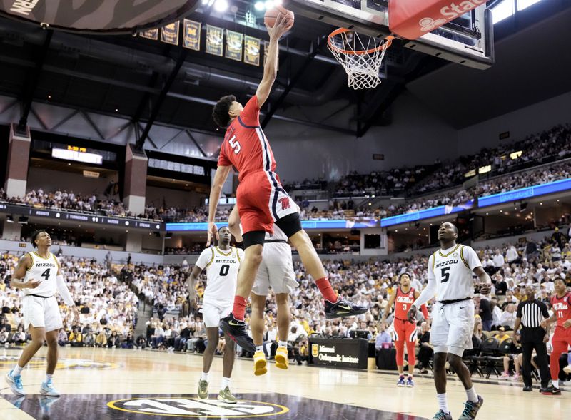 Mar 4, 2023; Columbia, Missouri, USA; Mississippi Rebels guard James White (5) shoots a layup as Missouri Tigers guard D'Moi Hodge (5) looks on during the second half at Mizzou Arena. Mandatory Credit: Denny Medley-USA TODAY Sports