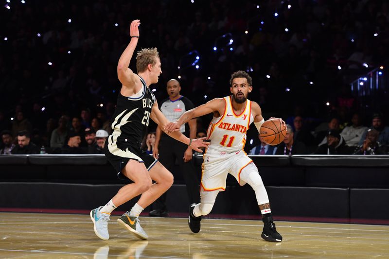 LAS VEGAS, NV - DECEMBER 14: Trae Young #11 of the Atlanta Hawks drives to the basket during the game against the Milwaukee Bucks during the Emirates NBA Cup Semifinal game on December 14, 2024 at T-Mobile Arena in Las Vegas, Nevada. NOTE TO USER: User expressly acknowledges and agrees that, by downloading and/or using this Photograph, user is consenting to the terms and conditions of the Getty Images License Agreement. Mandatory Copyright Notice: Copyright 2024 NBAE (Photo by Juan Ocampo/NBAE via Getty Images)