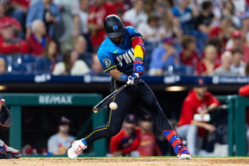 May 31, 2024; Philadelphia, Pennsylvania, USA; Philadelphia Phillies outfielder Johan Rojas (18) hits an RBI single during the seventh inning against the St. Louis Cardinals at Citizens Bank Park. Mandatory Credit: Bill Streicher-USA TODAY Sports