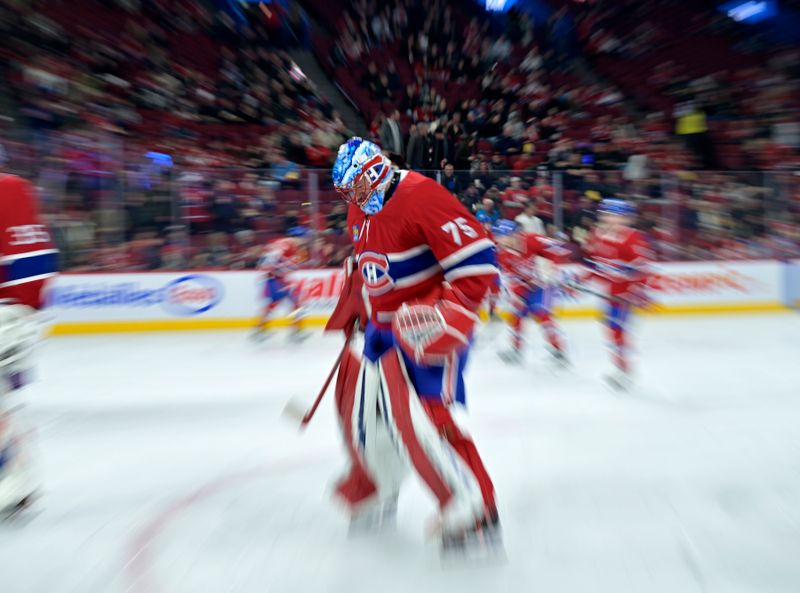 Jan 25, 2025; Montreal, Quebec, CAN; Montreal Canadiens goalie Jakub Dobes (75) skates during the warmup period before the game against the New Jersey Devils at the Bell Centre. Mandatory Credit: Eric Bolte-Imagn Images