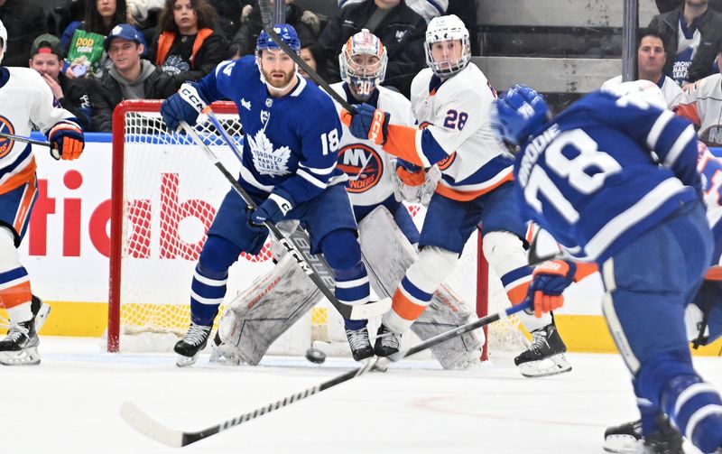 Feb 5, 2024; Toronto, Ontario, CAN; (Editors Notes: Caption Correction) New York Islanders goalie Ilya Sorokin (30) looks for the puck behind defenseman Alexander Romanov (28) and Toronto Maple Leafs forward Noah Gregor (18) in the second period at Scotiabank Arena. Mandatory Credit: Dan Hamilton-USA TODAY Sports