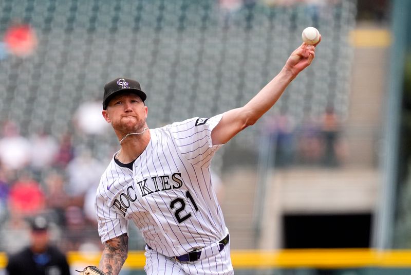 Sep 21, 2025; Denver, Colorado, USA; Colorado Rockies starting pitcher Kyle Freeland (21) delivers a ball in the first inning against the Los Angeles Angels at Coors Field. Mandatory Credit: Ron Chenoy-Imagn Images