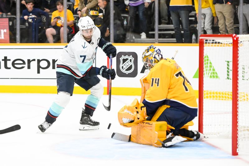 Oct 15, 2024; Nashville, Tennessee, USA;  Nashville Predators goaltender Juuse Saros (74) blocks the shot of Seattle Kraken right wing Jordan Eberle (7) during the second period at Bridgestone Arena. Mandatory Credit: Steve Roberts-Imagn Images