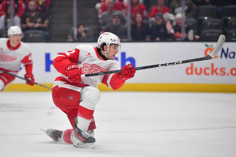 Nov 15, 2024; Anaheim, California, USA; Detroit Red Wings center Marco Kasper (92) takes a shot on goal against the Anaheim Ducks during the first period at Honda Center. Mandatory Credit: Gary A. Vasquez-Imagn Images