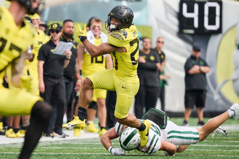 Sep 2, 2023; Eugene, Oregon, USA; Oregon Ducks running back Jayden Limar (27) breaks away from Portland State Vikings linebacker Peyton Wing (57) during the second half at Autzen Stadium. Mandatory Credit: Troy Wayrynen-USA TODAY Sports