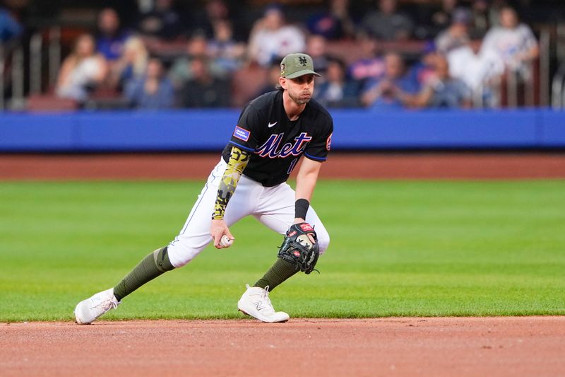 May 21, 2023; New York City, New York, USA; New York Mets second baseman Jeff McNeil (1) fields a ground ball hit by Cleveland Guardians first baseman Josh Naylor (22) (not pictured) during the first inning at Citi Field. Mandatory Credit: Gregory Fisher-USA TODAY Sports