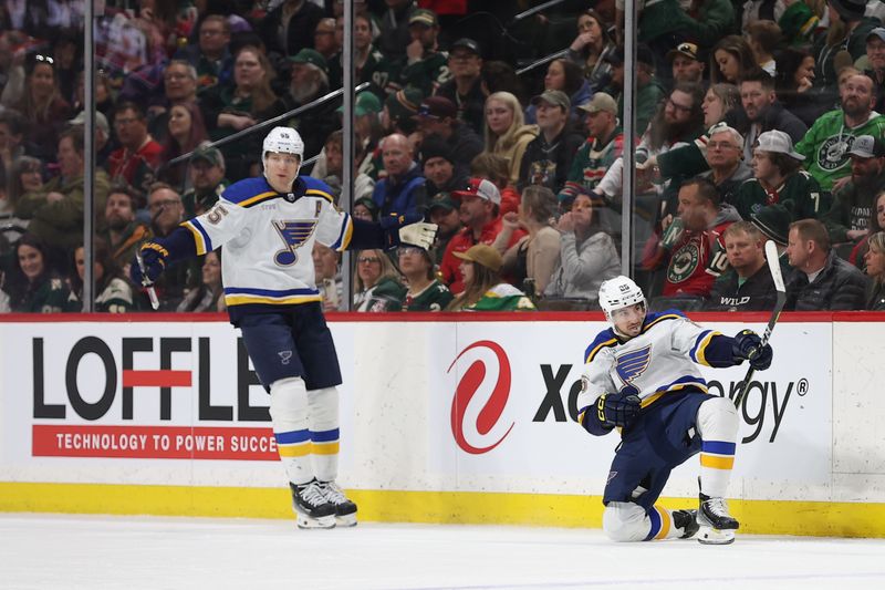 Mar 23, 2024; Saint Paul, Minnesota, USA; St. Louis Blues center Jordan Kyrou (25) celebrates his hat-trick against the Minnesota Wild during the third period at Xcel Energy Center. Mandatory Credit: Matt Krohn-USA TODAY Sports