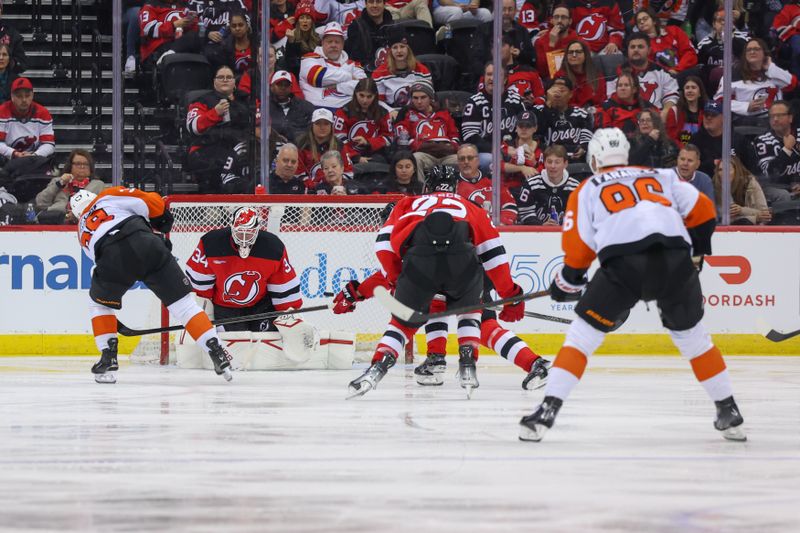 Jan 18, 2025; Newark, New Jersey, USA; Philadelphia Flyers right wing Matvei Michkov (39) scores a goal on New Jersey Devils goaltender Jake Allen (34) during the second period at Prudential Center. Mandatory Credit: Ed Mulholland-Imagn Images