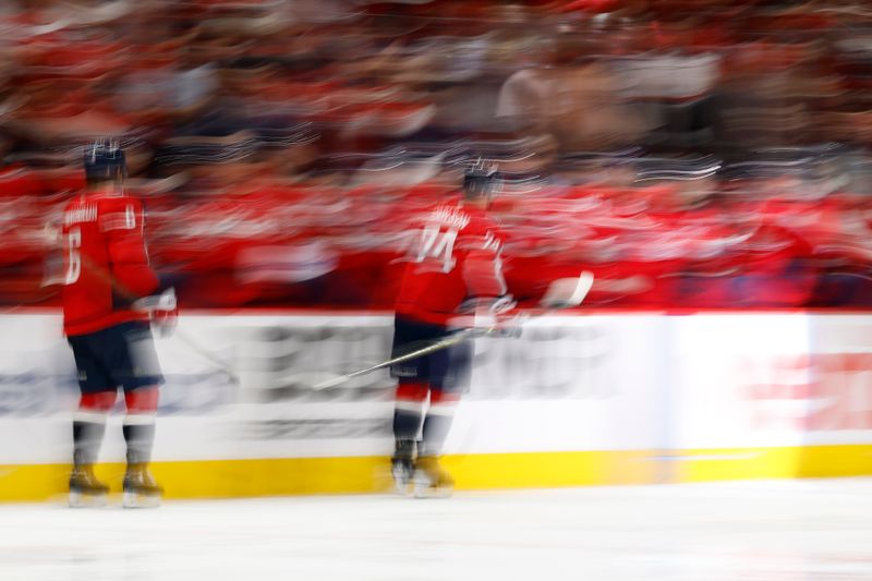 May 8, 2025; Washington, District of Columbia, USA; Washington Capitals defenseman John Carlson (74) celebrates with teammates after scoring a goal against the Carolina Hurricanes in the third period in game two of the second round of the 2025 Stanley Cup Playoffs at Capital One Arena. Mandatory Credit: Geoff Burke-Imagn Images
