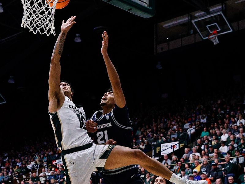 Mar 1, 2025; Fort Collins, Colorado, USA; Colorado State Rams guard Nique Clifford (10) and Utah State Aggies center Aubin Gateretse (21) battle for a rebound in the second half at Moby Arena. Mandatory Credit: Isaiah J. Downing-Imagn Images