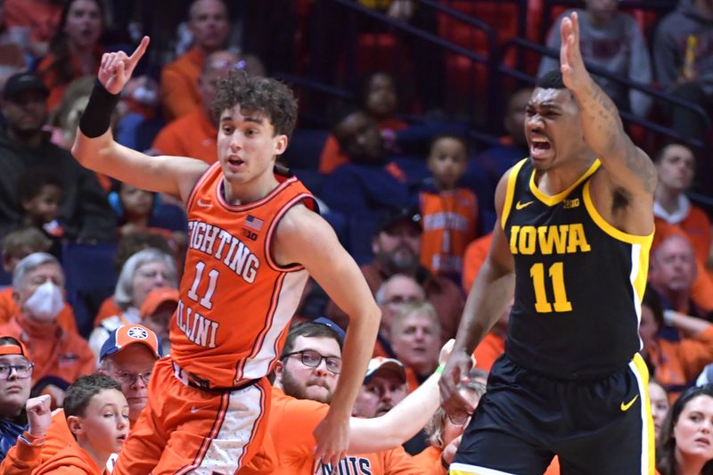 Feb 24, 2024; Champaign, Illinois, USA;  Illinois Fighting Illini guard Niccolo Moretti (11) and Iowa Hawkeyes guard Tony Perkins (11) look for the possession call during the second half at State Farm Center. Mandatory Credit: Ron Johnson-USA TODAY Sports