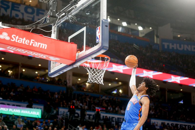 OKLAHOMA CITY, OKLAHOMA - JANUARY 03: Jalen Williams #8 of the Oklahoma City Thunder dunks the ball during the second quarter against the Boston Celtics at Paycom Center on January 03, 2023 in Oklahoma City, Oklahoma. NOTE TO USER: User expressly acknowledges and agrees that, by downloading and or using this photograph, User is consenting to the terms and conditions of the Getty Images License Agreement.  (Photo by Ian Maule/Getty Images)