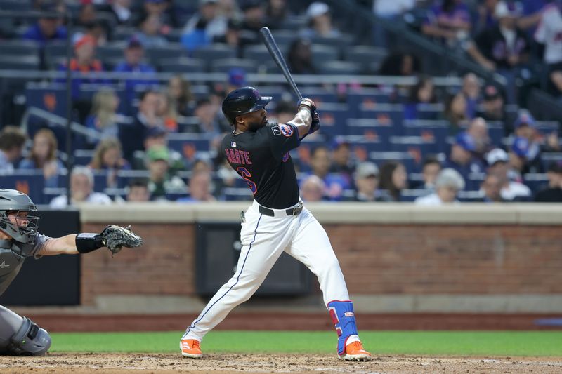 May 30, 2025; New York City, New York, USA; New York Mets designated hitter Starling Marte (6) follows through on a solo home run against the Colorado Rockies during the fourth inning at Citi Field. Mandatory Credit: Brad Penner-Imagn Images