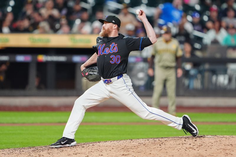 Jun 14, 2024; New York City, New York, USA; New York Mets pitcher Jake Diekman (30) delivers a pitch against the San Diego Padres during the seventh inning at Citi Field. Mandatory Credit: Gregory Fisher-USA TODAY Sports