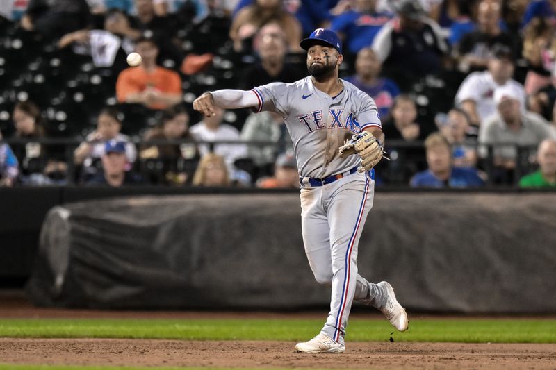 Aug 29, 2023; New York City, New York, USA; Texas Rangers shortstop Ezequiel Duran (20) throws to first base for an out against the New York Mets during the third inning at Citi Field. Mandatory Credit: John Jones-USA TODAY Sports