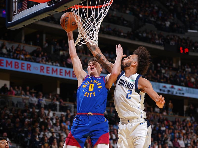 DENVER, CO - NOVEMBER 22: Dereck Lively II #2 of the Dallas Mavericks blocks the basket during the game against the Denver Nuggets during the Emirates NBA Cup game on November 22, 2024 at Ball Arena in Denver, Colorado. NOTE TO USER: User expressly acknowledges and agrees that, by downloading and/or using this Photograph, user is consenting to the terms and conditions of the Getty Images License Agreement. Mandatory Copyright Notice: Copyright 2024 NBAE (Photo by Garrett Ellwood/NBAE via Getty Images)