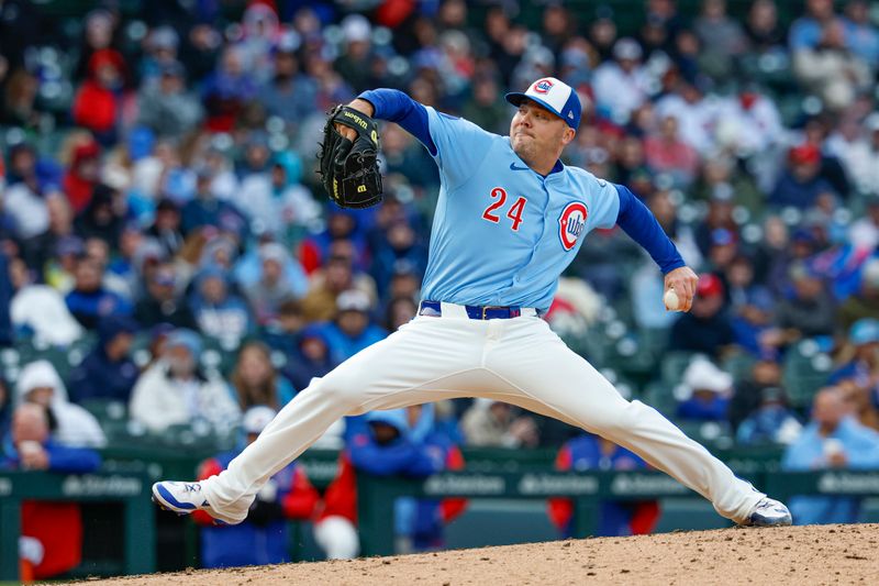 Apr 25, 2025; Chicago, Illinois, USA; Chicago Cubs relief pitcher Caleb Thielbar (24) delivers a pitch against the Philadelphia Phillies during the sixth inning at Wrigley Field. Mandatory Credit: Kamil Krzaczynski-Imagn Images