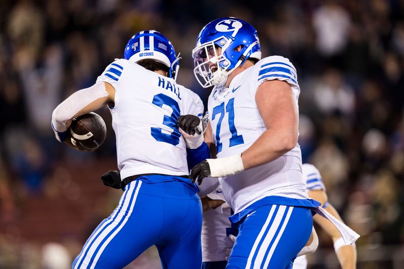 Nov 26, 2022; Stanford, California, USA;  Brigham Young Cougars quarterback Jaren Hall (3) celebrates with offensive lineman Blake Freeland (71) after scoring a touchdown against the Stanford Cardinal during the first half at Stanford Stadium. Mandatory Credit: John Hefti-USA TODAY Sports