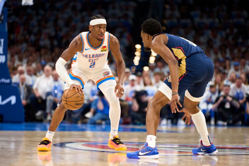 OKLAHOMA CITY, OKLAHOMA - APRIL 21: Shai Gilgeous-Alexander #2 of the Oklahoma City Thunder brings the ball up court against the New Orleans Pelicans in game one of the Western Conference First Round Playoffs at the Paycom Center on April 21, 2024 in Oklahoma City, Oklahoma. NOTE TO USER: User expressly acknowledges and agrees that, by downloading and or using this photograph, User is consenting to the terms and conditions of the Getty Images License Agreement.  (Photo by Cooper Neill/Getty Images)