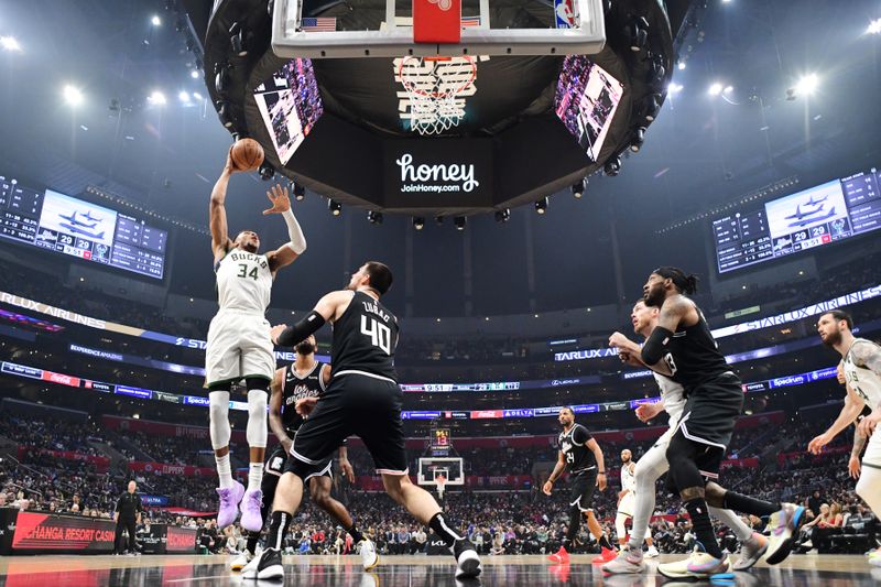 LOS ANGELES, CA - FEBRUARY 10: Giannis Antetokounmpo #34 of the Milwaukee Bucks rebounds the ball during the game against the LA Clippers n February 10, 2023 at Crypto.Com Arena in Los Angeles, California. NOTE TO USER: User expressly acknowledges and agrees that, by downloading and/or using this Photograph, user is consenting to the terms and conditions of the Getty Images License Agreement. Mandatory Copyright Notice: Copyright 2023 NBAE (Photo by Adam Pantozzi/NBAE via Getty Images)