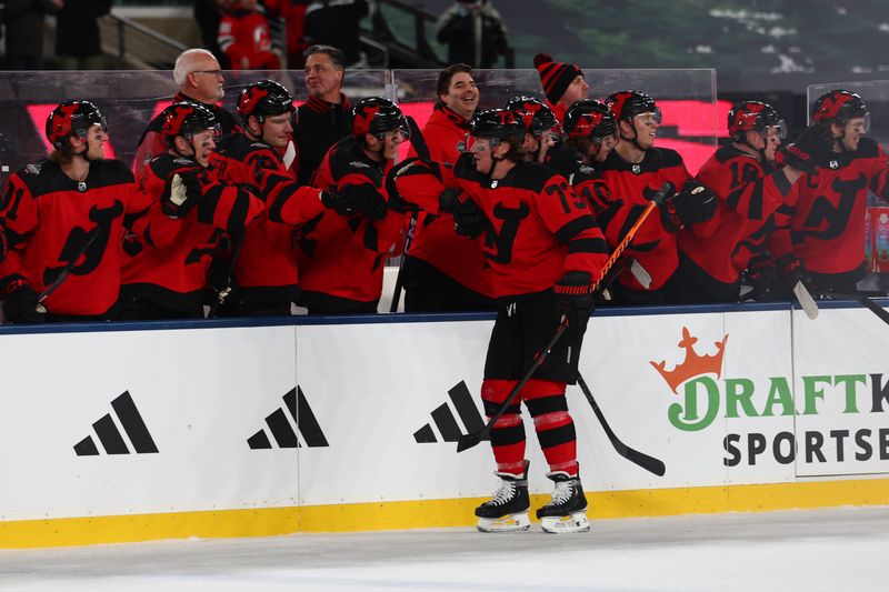 Feb 17, 2024; East Rutherford, New Jersey, USA; New Jersey Devils right wing Tyler Toffoli (73) celebrates his goal against the Philadelphia Flyers during the first period in a Stadium Series ice hockey game at MetLife Stadium. Mandatory Credit: Ed Mulholland-USA TODAY Sports