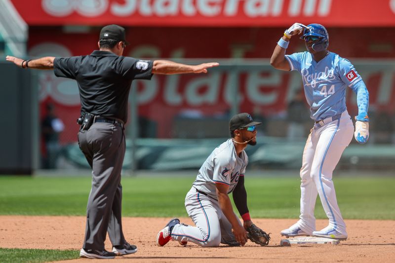 Jun 26, 2024; Kansas City, Missouri, USA; Kansas City Royals outfielder Dairon Blanco (44) steals second base against Miami Marlins second base Otto Lopez (61) during the eighth inning at Kauffman Stadium. Mandatory Credit: William Purnell-USA TODAY Sports