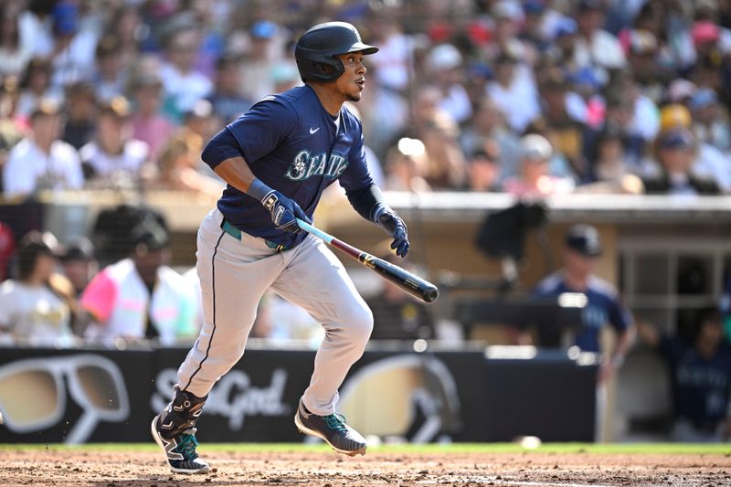 Jul 10, 2024; San Diego, California, USA; Seattle Mariners second baseman Jorge Polanco (7) hits a RBI single against the San Diego Padres during the fourth inning at Petco Park. Mandatory Credit: Orlando Ramirez-USA TODAY Sports