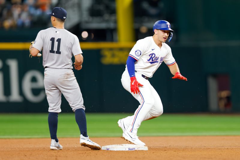 Sep 4, 2024; Arlington, Texas, USA; Texas Rangers outfielder Wyatt Langford (36) doubles in a run during the fourth inning against the New York Yankees at Globe Life Field. Mandatory Credit: Andrew Dieb-Imagn Images