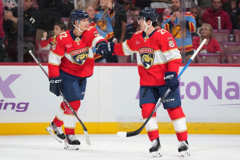 Nov 16, 2024; Sunrise, Florida, USA;  Florida Panthers right wing Mackie Samoskevich  (25) celebrates with defenseman Gustav Forsling (42) after scoring goal against the Winnipeg Jets during the first period at Amerant Bank Arena. Mandatory Credit: Jim Rassol-Imagn Images