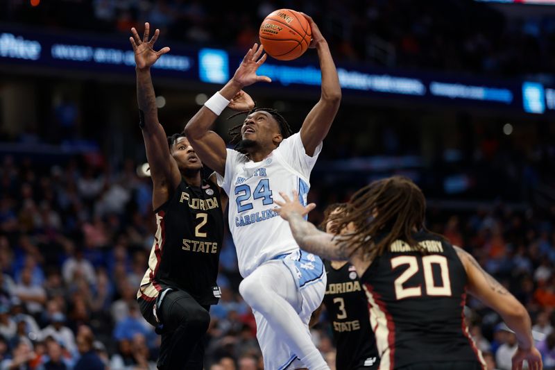 Mar 14, 2024; Washington, D.C., USA; North Carolina forward Jae'Lyn Withers (24) attempts to dunk the ball as Florida State forward Jamir Watkins (2) defends in the second half at Capital One Arena. Mandatory Credit: Geoff Burke-USA TODAY Sports