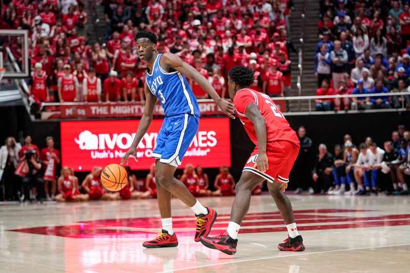 Jan 10, 2026; Salt Lake City, Utah, USA; BYU Cougars forward AJ Dybantsa (3) controls the ball during the first half against the Utah Utes at Jon M. Huntsman Center. Mandatory Credit: Aaron Baker-Imagn Images