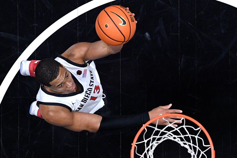 Jan 6, 2024; San Diego, California, USA; San Diego State Aztecs forward Jaedon LeDee (13) goes to the basket during the first half against the UNLV Rebels at Viejas Arena. Mandatory Credit: Orlando Ramirez-USA TODAY Sports