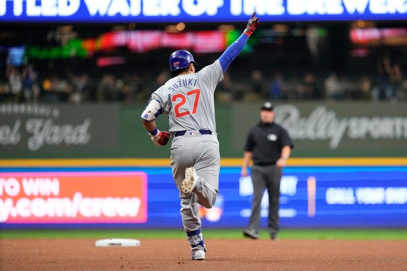 Jun 28, 2024; Milwaukee, Wisconsin, USA;  Chicago Cubs designated hitter Seiya Suzuki (27) celebrates while rounding the bases after hitting a home run during the fourth inning against the Milwaukee Brewers at American Family Field. Mandatory Credit: Jeff Hanisch-USA TODAY Sports