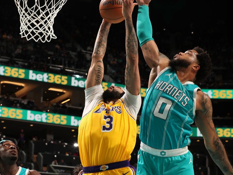 CHARLOTTE, NC - JANUARY 27:  Anthony Davis #3 of the Los Angeles Lakers grabs the rebound during the game against the Charlotte Hornets on January 27, 2025 at Spectrum Center in Charlotte, North Carolina. NOTE TO USER: User expressly acknowledges and agrees that, by downloading and or using this photograph, User is consenting to the terms and conditions of the Getty Images License Agreement. Mandatory Copyright Notice: Copyright 2025 NBAE (Photo by Kent Smith/NBAE via Getty Images)