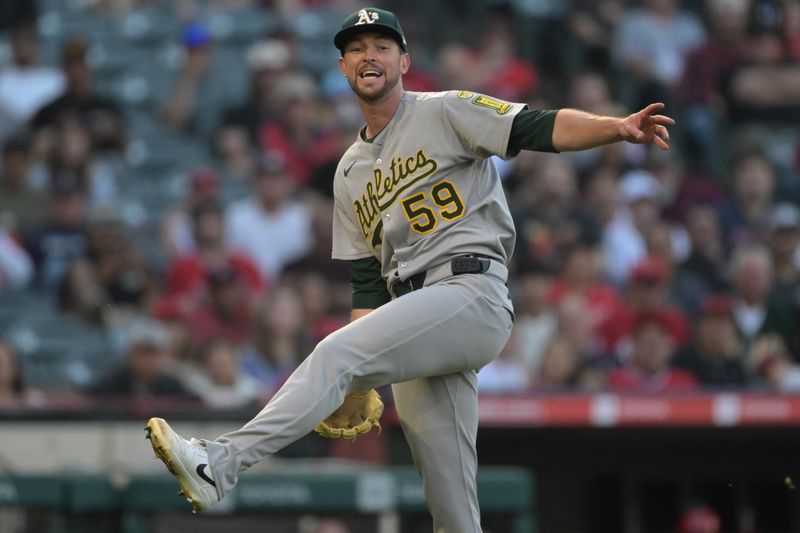 Jun 9, 2025; Anaheim, California, USA;   Athletics starting pitcher Jeffrey Springs (58) reacts after making an error on a throw to first on a bunt by Los Angeles Angels second baseman Scott Kingery (13) in the third inning at Angel Stadium. Mandatory Credit: Jayne Kamin-Oncea-Imagn Images