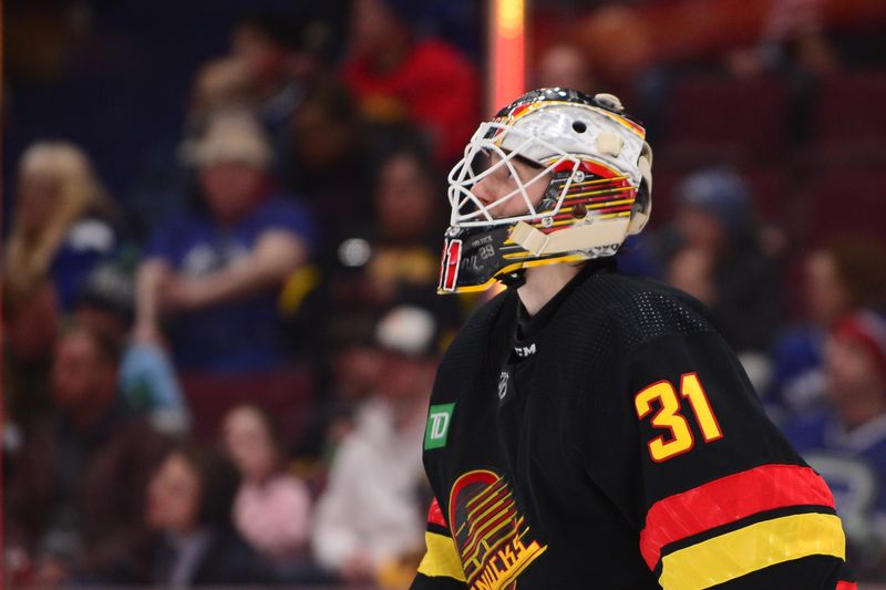 Feb 25, 2023; Vancouver, British Columbia, CAN; Vancouver Canucks goaltender Arturs Silovs (31) watches play against the Boston Bruins during the second period at Rogers Arena. Mandatory Credit: Anne-Marie Sorvin-USA TODAY Sports