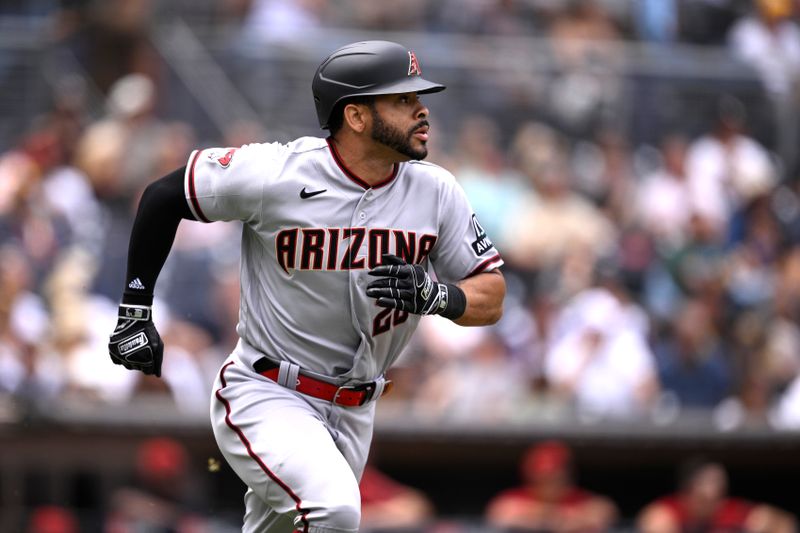 Aug 19, 2023; San Diego, California, USA; Arizona Diamondbacks designated hitter Tommy Pham (28) hits a triple against the San Diego Padres during the third inning at Petco Park. Mandatory Credit: Orlando Ramirez-USA TODAY Sports