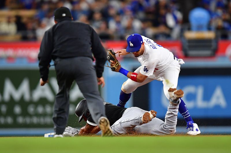 Jun 14, 2023; Los Angeles, California, USA; Chicago White Sox second baseman Elvis Andrus (1) is caught stealing second against Los Angeles Dodgers shortstop Miguel Rojas (11) during the eighth inning at Dodger Stadium. Mandatory Credit: Gary A. Vasquez-USA TODAY Sports