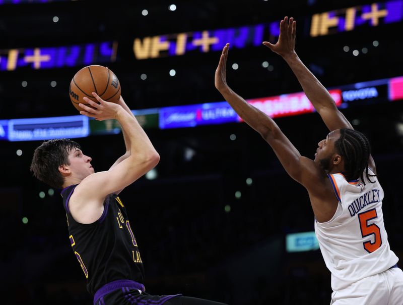 LOS ANGELES, CALIFORNIA - DECEMBER 18: Austin Reaves #15 of the Los Angeles Lakers shoots a jumper in front of Immanuel Quickley #5 of the New York Knicks during a 114-109 Knicks win at Crypto.com Arena on December 18, 2023 in Los Angeles, California. NOTE TO USER: User expressly acknowledges and agrees that, by downloading and or using this photograph, User is consenting to the terms and conditions of the Getty Images License Agreement. (Photo by Harry How/Getty Images)