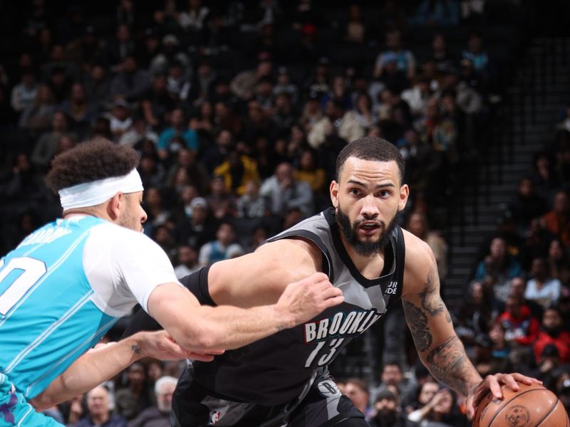 BROOKLYN, NY - FEBRUARY 10: Tyrese Martin #13 of the Brooklyn Nets dribbles the ball during the game against the Charlotte Hornets on February 10, 2025 at Barclays Center in Brooklyn, New York. NOTE TO USER: User expressly acknowledges and agrees that, by downloading and or using this Photograph, user is consenting to the terms and conditions of the Getty Images License Agreement. Mandatory Copyright Notice: Copyright 2025 NBAE (Photo by Nathaniel S. Butler/NBAE via Getty Images)