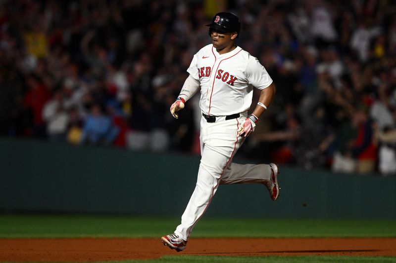 May 17, 2025; Boston, Massachusetts, USA; Boston Red Sox designated hitter Rafael Devers (11) hits a walk off home run against the Atlanta Braves during the ninth inning at Fenway Park. Mandatory Credit: Brian Fluharty-Imagn Images
