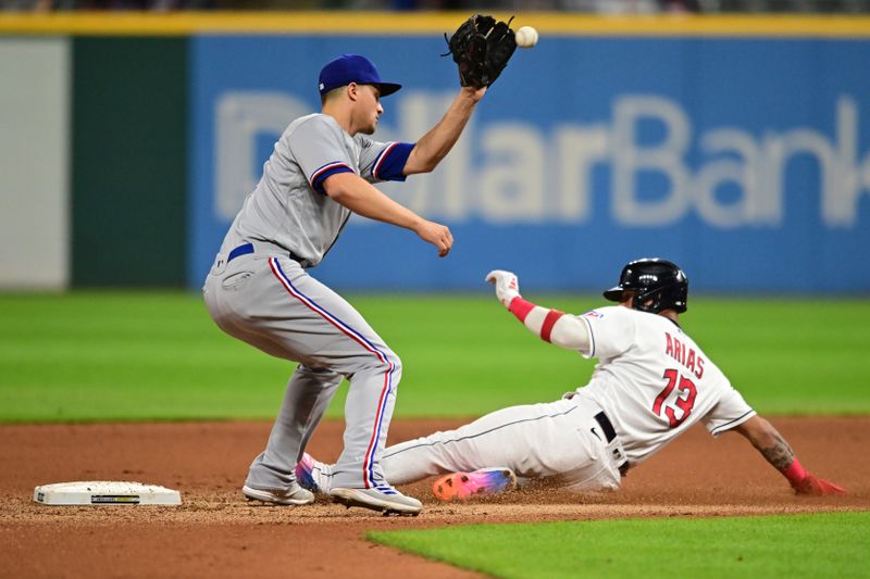 Sep 15, 2023; Cleveland, Ohio, USA; Cleveland Guardians shortstop Gabriel Arias (13) steals second as Texas Rangers shortstop Corey Seager (5) waits for the throw during the fourth inning at Progressive Field. Mandatory Credit: Ken Blaze-USA TODAY Sports